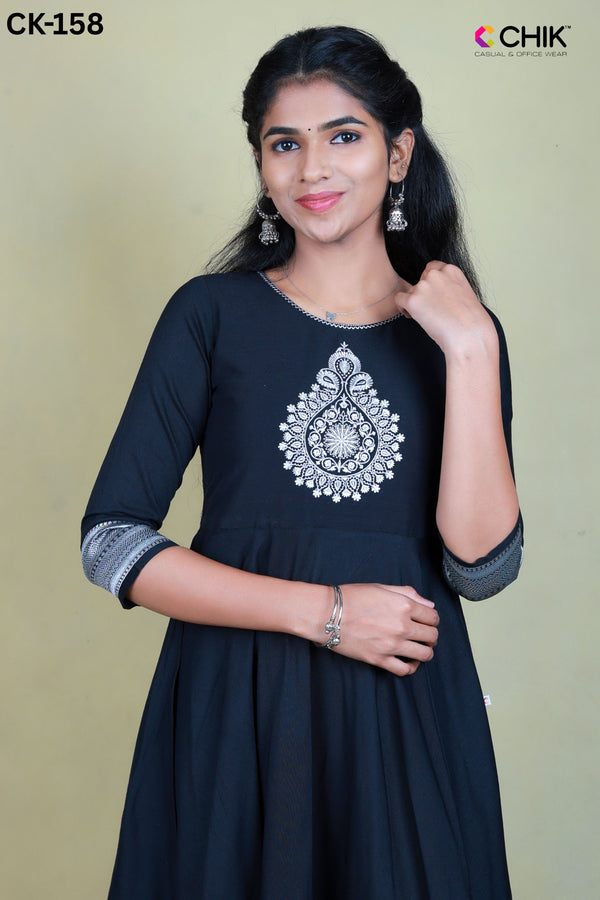 CK-158 BLACK  COLOUR RAW SILK FABRIC FULL FLARE ANARKALI FIT & THILAGAM EMROIDERY WORK WITH SILVER ZARI TOP LENGTH-52' SLEEVE-16'