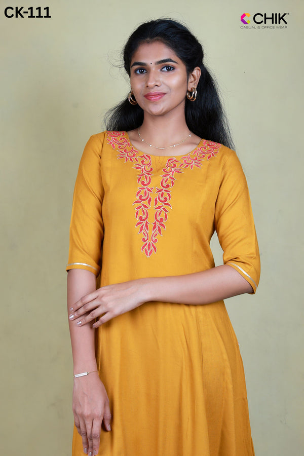 CK-111 MUSTARD YELLOW COLOUR RAYON FABRIC ANARKALI FIT & FLORAL EMBROIDERY WORK TOP LENGTH-46' SLEEVE-16'