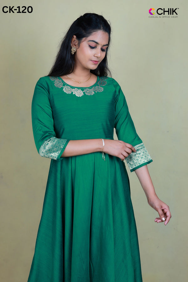 CK-120 GREEN COLOUR RAW SILK FABRIC FULL FLARE ANARKALI FIT & BORDER EMBROIDERY WORK WITH GOLD ZARI TOP LENGTH-52' SLEEVE -16'.