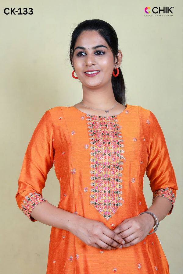 CK-133  ORANGE  COLOUR RAW SILK FABRIC ANARKALI FIT & YOKE EMBROIDERY WORK & SMALL BUTTAS WITH SEQUENCE TOP LENGTH-46' SLEEVE-16'.